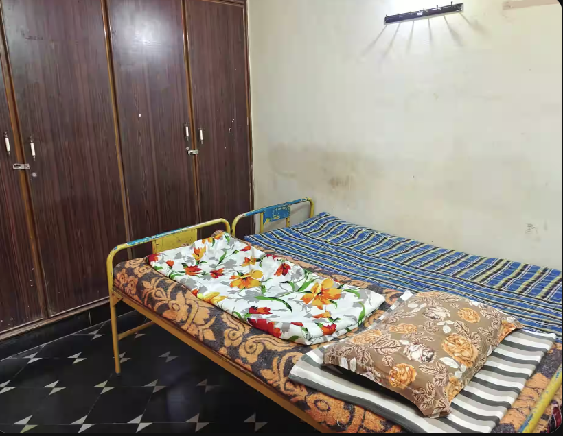 Non-AC 2 sharing room with single beds at Amigos Gents Hostel, Labbipet, Vijayawada