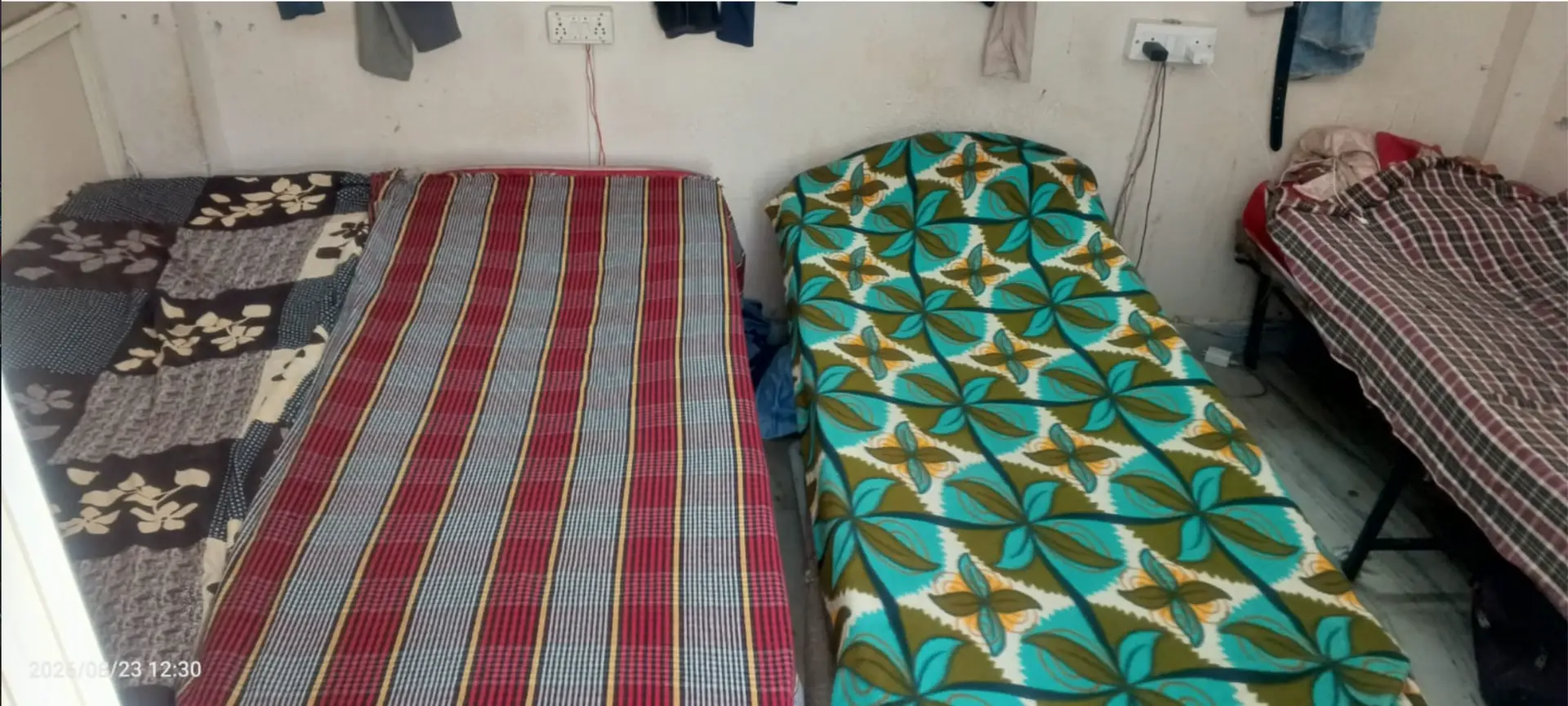 Non-AC 4 sharing room with single beds at Amigos Gents Hostel, Labbipet, Vijayawada